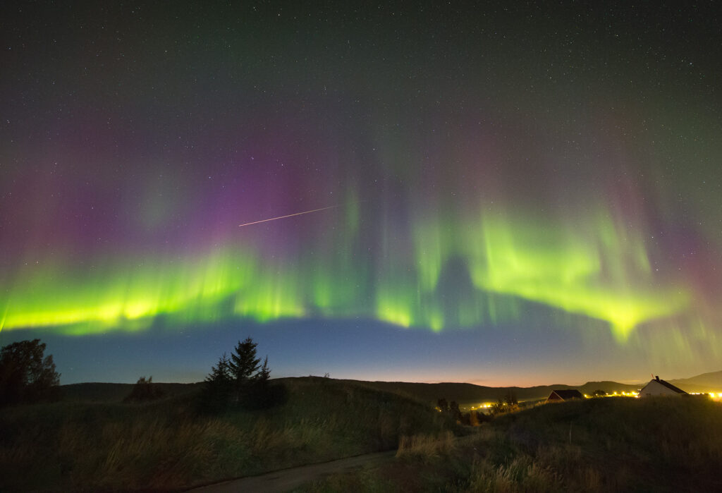 shooting stars through aurora