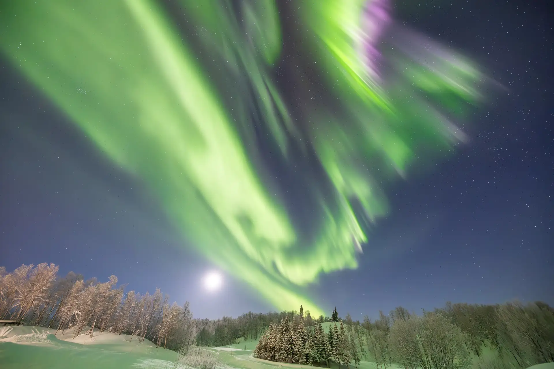 Aurora over resort landscape